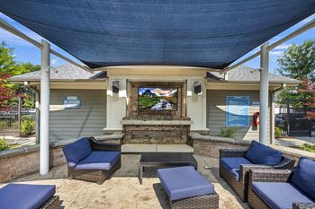 Outdoor Lounge with Firepit and Flat Screen TVs